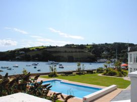 An outdoor area with a pool and view of boats on water at 35 The Salcombe in Salcombe