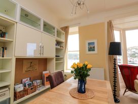 An office with a table and bookshelf at 3 Dartview in Dartmouth