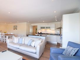 A living room with a dining area and kitchen at 4 Bolt Head Salcombe