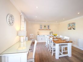 A dining room with a table and chairs at 4 Bolt Head Salcombe