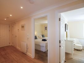 A hallway with a view of a bedroom and an office at 4 Bolt Head Salcombe