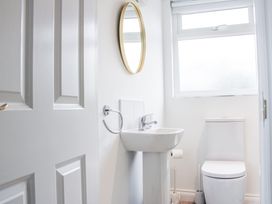 A bathroom with a sink and toilet at 4 Lyndhurst in Salcombe