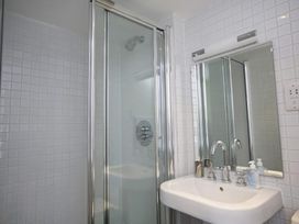A bathroom with a shower and sink at 6 Combehaven Salcombe