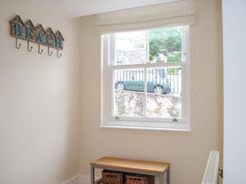 An entryway with a bench and a window at 6 Combehaven Salcombe