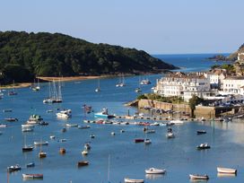 A view of boats in the water with houses by the harbor at 6 Combehaven Salcombe