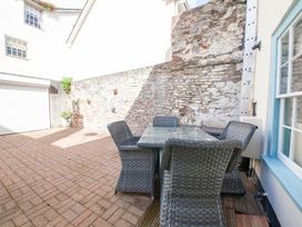 An outdoor area with a table and chairs at 7 Charles Street Dartmouth