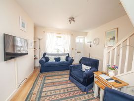 A living room with furniture and a television at 7 Charles Street Dartmouth