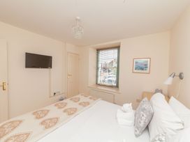 A bedroom with a bed and television at 7 Charles Street Dartmouth