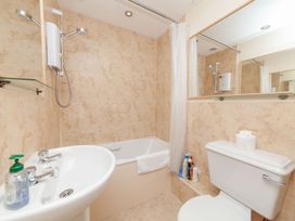 A bathroom with a bathtub and sink at 7 Charles Street Dartmouth
