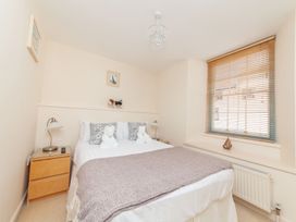 A bedroom with a bed and nightstand at 7 Charles Street Dartmouth