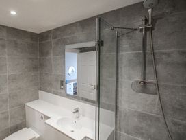 A bathroom with shower, sink, and toilet at 7 Thurlestone Rock in Thurlestone