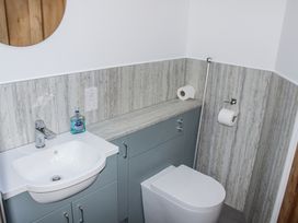A bathroom with a sink and toilet at Armada Cottage Dartmouth