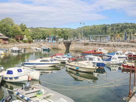 A marina with boats docked in the water at Armada Cottage Dartmouth