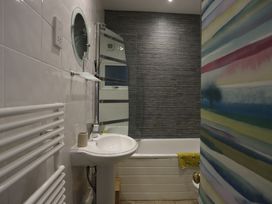 A bathroom with a sink and bathtub at Dart Views in Dartmouth