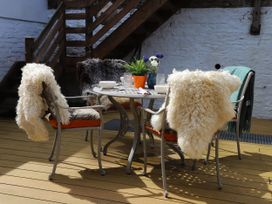 A dining area with chairs and a table at Dart Views in Dartmouth
