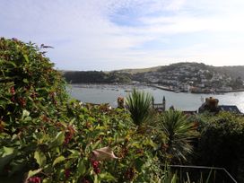 A view of boats on water with houses on hills at Dart Views in Dartmouth