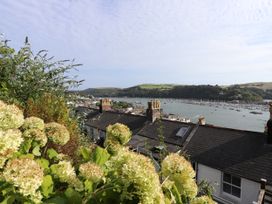 A view of the river with boats and rooftops at Dart Views in Dartmouth