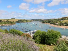 A view of water with boats and hills at Edinburgh House in Salcombe