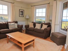 A living room with couches and a coffee table at Savernake in Thurlestone