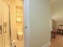 A bathroom with a shower and toilet at Savernake in Thurlestone