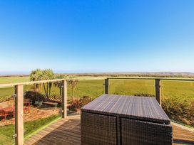 An outdoor area with a table and views of a field at The Station in Bolberry