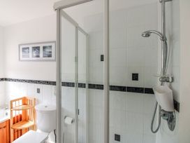 A bathroom with a shower and toilet at The Station in Bolberry