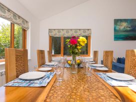 A dining room with a table set for meals at Mellydonen Beder Del (Melly), Tor Down Quarry, St Breward