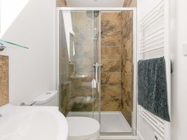 A bathroom with a shower and toilet at Mellydonen Beder Del (Melly), Tor Down Quarry St Breward