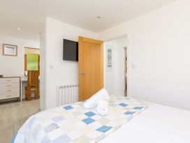 A bedroom with bed, desk and chair at Mellydonen Beder Del (Melly), Tor Down Quarry St Breward