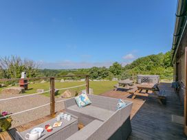 Outdoor area with seating and hot tub at Mellydonen Beder Del (Melly), Tor Down Quarry St Breward
