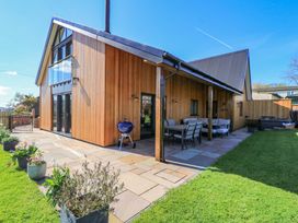 An outdoor area with a patio and furniture at The Old Dairy Cotleigh near Honiton