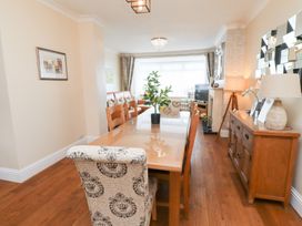 A dining room with a table and chairs at Beach Cove View, Newbiggin-by-the-Sea