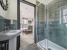 A bathroom with a sink and shower at Spring Park Farmhouse in Launceston