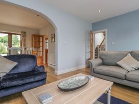 A living room with a sofa and coffee table at Langtree in Arnside