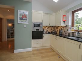 A kitchen with cabinets and appliances at Langtree in Arnside