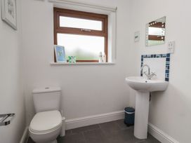 A bathroom with a toilet and sink at Langtree in Arnside