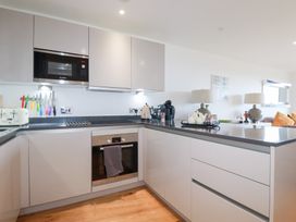 A kitchen with appliances and utensils at Apartment no.21 in Newquay