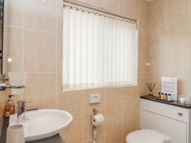 A bathroom featuring a sink and toilet at Whitsand, Tideford