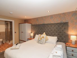 A bedroom with a bed and adjoining bathroom at Sir Nigel Gresley @ Engine Shed in Whitby