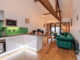 A living room with a kitchen area and furniture at Repton @ Engine Shed Whitby