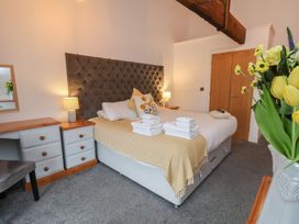 A bedroom with a bed and a desk at Repton @ Engine Shed in Whitby