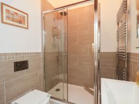 A bathroom with a shower and sink at Repton @ Engine Shed in Whitby