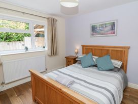 A bedroom with a bed and window at New Peny in Llandrindod Wells