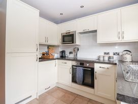 A kitchen with cabinets and appliances at 17 Fewster Way in York