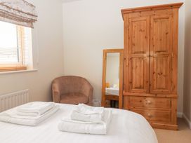 A bedroom with a bed and towels on it at 17 Fewster Way in York