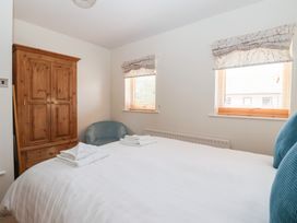 A bedroom with a bed and wardrobe at 17 Fewster Way in York