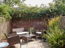 A garden with seating and plants at 17 Fewster Way York