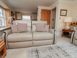 A living room with a sofa and coffee table at 5 Old Sail Loft in Whitby