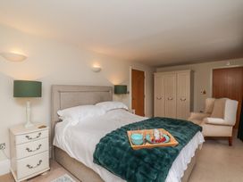 A bedroom with a bed and bedside table at 5 Old Sail Loft in Whitby