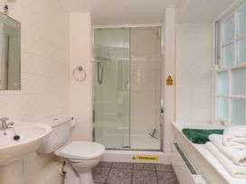 A bathroom with a shower and sink at 5 Old Sail Loft in Whitby